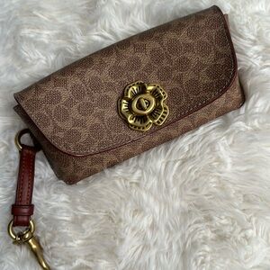 COACH signature sunglass case.